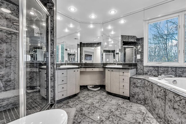 bathroom featuring vanity and plus walk in shower