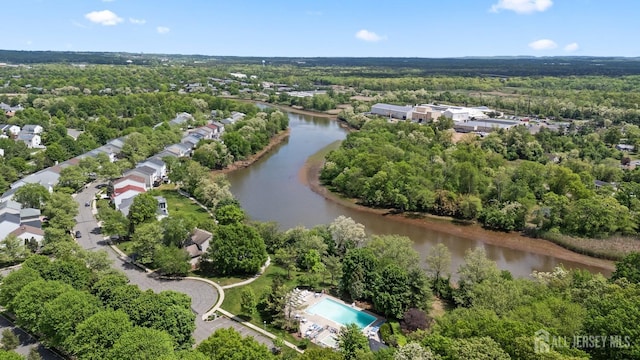7 Cornell Dr, East Brunswick, NJ 08816 - aerial view of a nearby body of water and a heavily wooded area