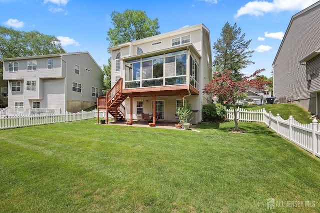 7 Cornell Dr, East Brunswick, NJ 08816 - back of house featuring a sunroom, a patio area, and stairs