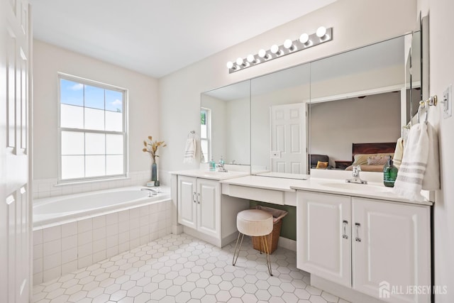 7 Cornell Dr, East Brunswick, NJ 08816 - ensuite bathroom with plenty of natural light, a bath, double vanity, and tile patterned flooring