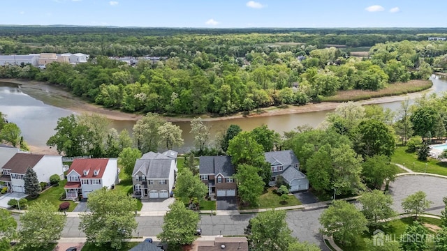 7 Cornell Dr, East Brunswick, NJ 08816 - aerial perspective of suburban area with a large body of water and a forest
