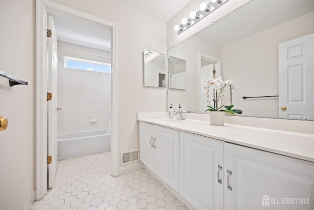 7 Cornell Dr, East Brunswick, NJ 08816 - bathroom featuring vanity, baseboards, washtub / shower combination, and tile patterned floors