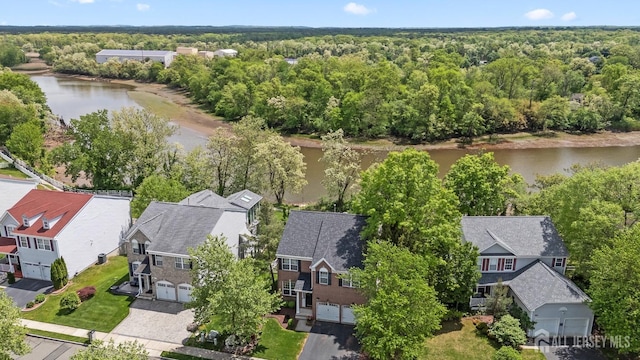 7 Cornell Dr, East Brunswick, NJ 08816 - aerial perspective of suburban area featuring a nearby body of water and a forest