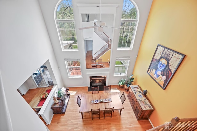 7 Cornell Dr, East Brunswick, NJ 08816 - living area with a towering ceiling, ceiling fan, wood finished floors, baseboards, and stairs