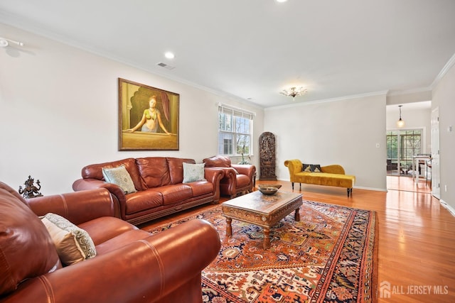 7 Cornell Dr, East Brunswick, NJ 08816 - living area with light wood finished floors, crown molding, recessed lighting, and baseboards