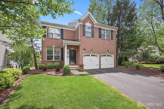 7 Cornell Dr, East Brunswick, NJ 08816 - view of front of property featuring driveway, brick siding, a garage, and a front lawn