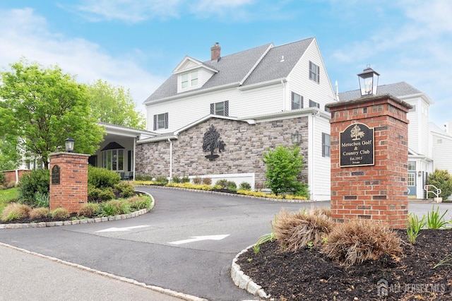 200 Plainfield Rd, Edison, NJ 08820 - view of front of home featuring stone siding and a chimney