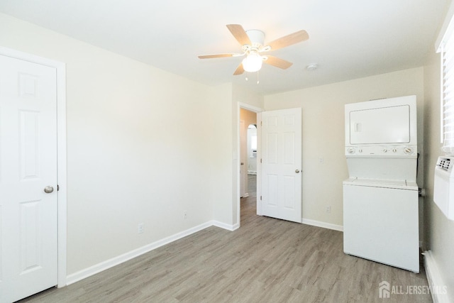 200 Plainfield Rd, Edison, NJ 08820 - laundry room with stacked washer / dryer, light wood-style floors, and ceiling fan