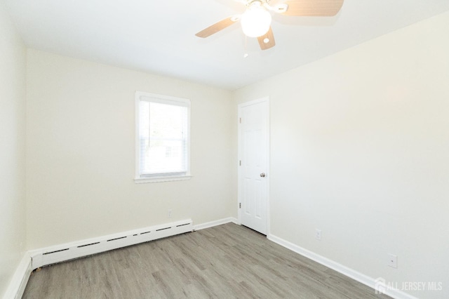 200 Plainfield Rd, Edison, NJ 08820 - unfurnished room featuring a baseboard radiator, wood finished floors, and ceiling fan