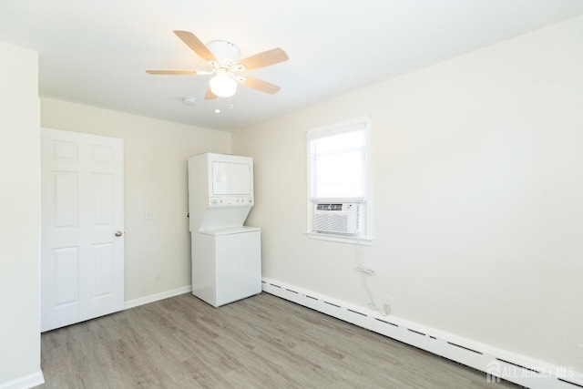 200 Plainfield Rd, Edison, NJ 08820 - laundry area featuring a baseboard radiator, stacked washer / drying machine, light wood-type flooring, ceiling fan, and cooling unit