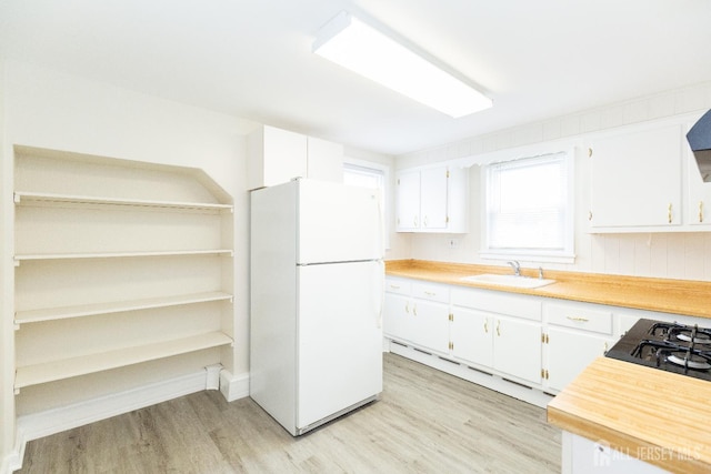 200 Plainfield Rd, Edison, NJ 08820 - kitchen featuring freestanding refrigerator, light wood-style flooring, white cabinets, and light countertops