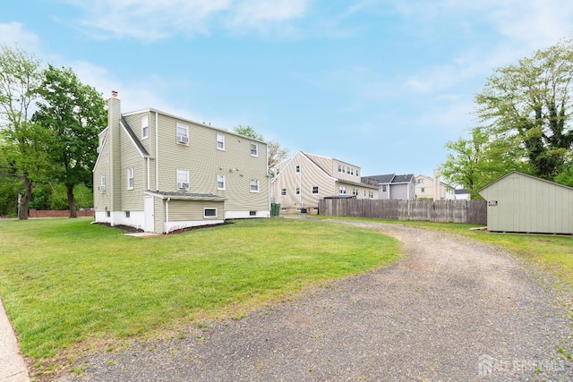 200 Plainfield Rd, Edison, NJ 08820 - back of property featuring a chimney, gravel driveway, and an outbuilding
