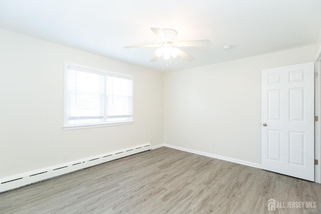 200 Plainfield Rd, Edison, NJ 08820 - unfurnished room with a baseboard radiator, wood finished floors, and ceiling fan