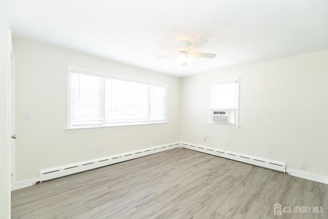 200 Plainfield Rd, Edison, NJ 08820 - spare room featuring wood finished floors, baseboard heating, a ceiling fan, and cooling unit