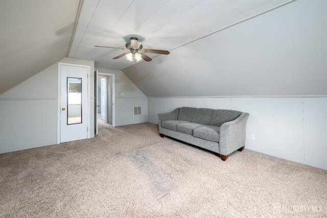 additional living space with lofted ceiling, carpet flooring, visible vents, and ceiling fan