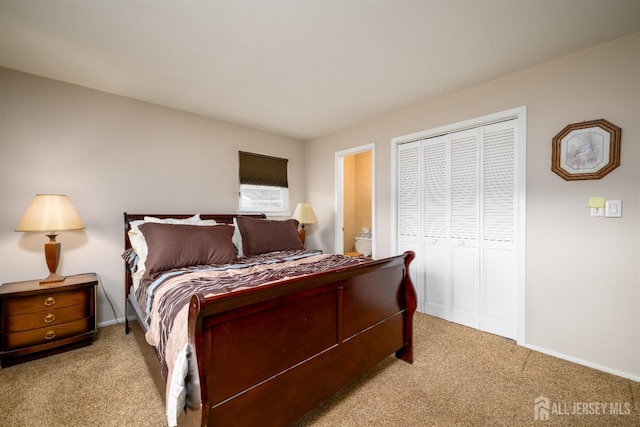 bedroom with baseboards, a closet, and light carpet