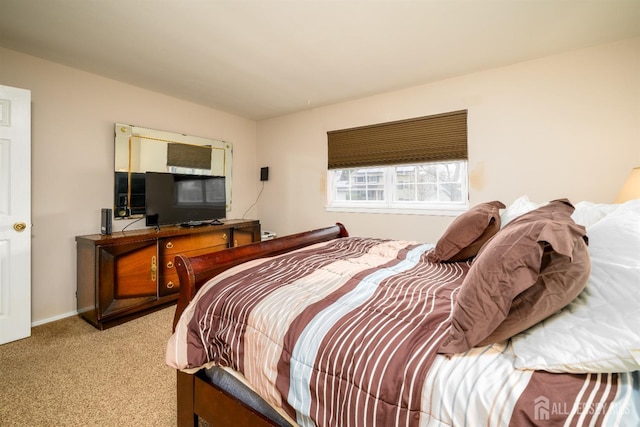 bedroom featuring light carpet