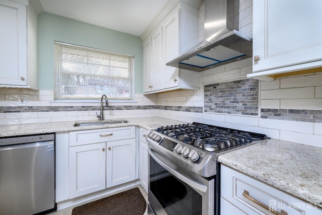 57 Athens Ave, Old Bridge, NJ 08879 - kitchen with appliances with stainless steel finishes, wall chimney range hood, a sink, white cabinets, and tasteful backsplash