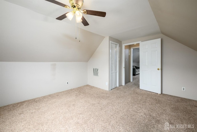 bonus room with carpet flooring, visible vents, lofted ceiling, and ceiling fan