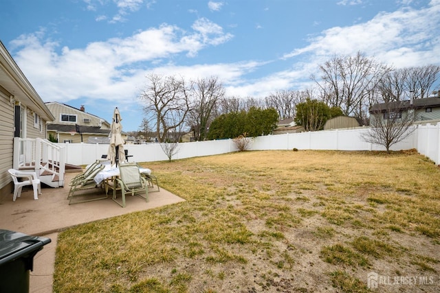 view of yard featuring a patio and a fenced backyard