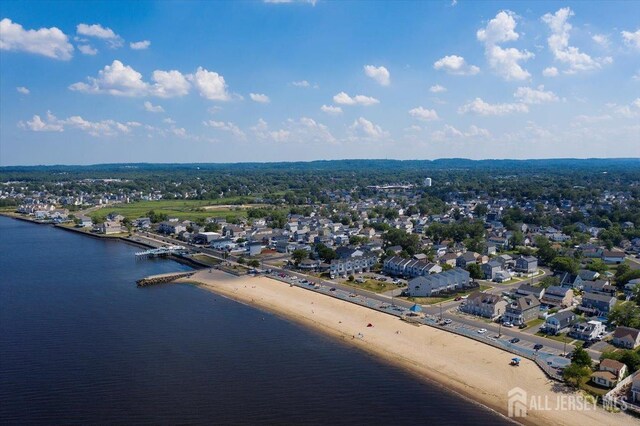 bird's eye view featuring a beach view and a water view