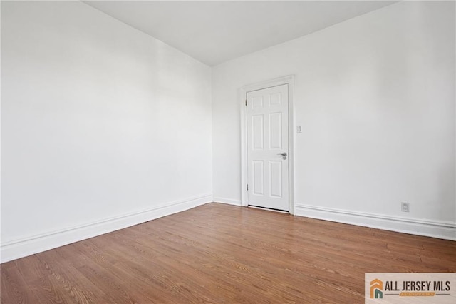 57 Corbin Ave Unit 24, Jersey City, NJ 07306 - empty room with wood finished floors and baseboards