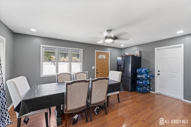 dining room with recessed lighting, ceiling fan, baseboards, and wood finished floors