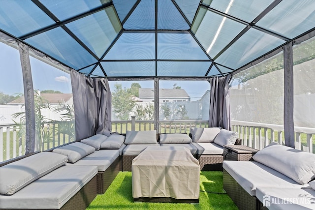 sunroom / solarium featuring lofted ceiling