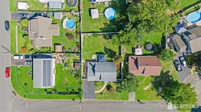 birds eye view of property with a residential view