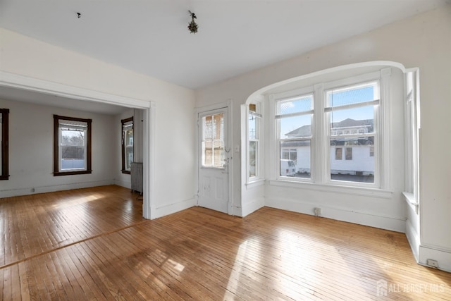 entrance foyer featuring light wood-style flooring and baseboards