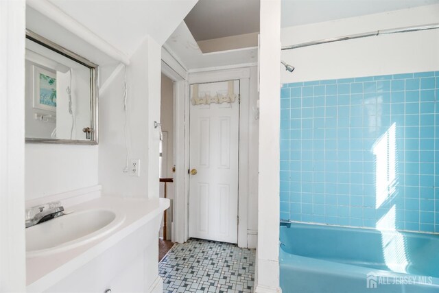 bathroom featuring vanity and bathtub / shower combination