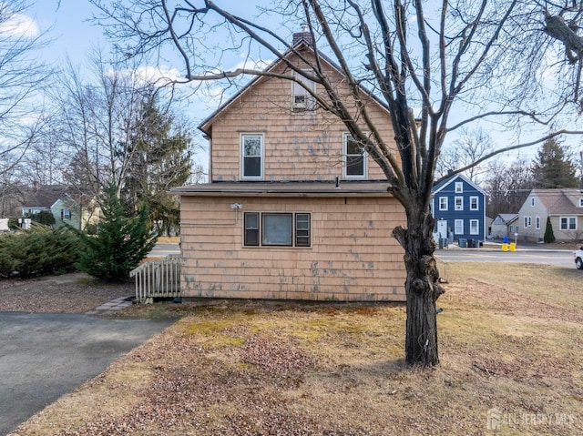 view of side of property with a chimney