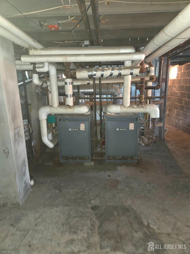 utility room featuring gas water heater