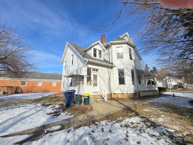 view of snow covered house