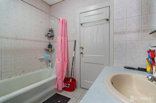 349 Livingston Ave, New Brunswick, NJ 08901 - full bath featuring a sink, tile walls, tile patterned flooring, and shower / bath combo with shower curtain
