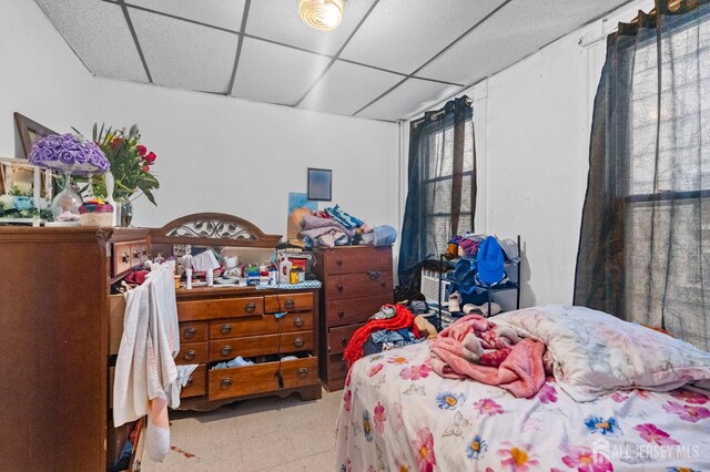 349 Livingston Ave, New Brunswick, NJ 08901 - bedroom with a paneled ceiling and tile patterned floors