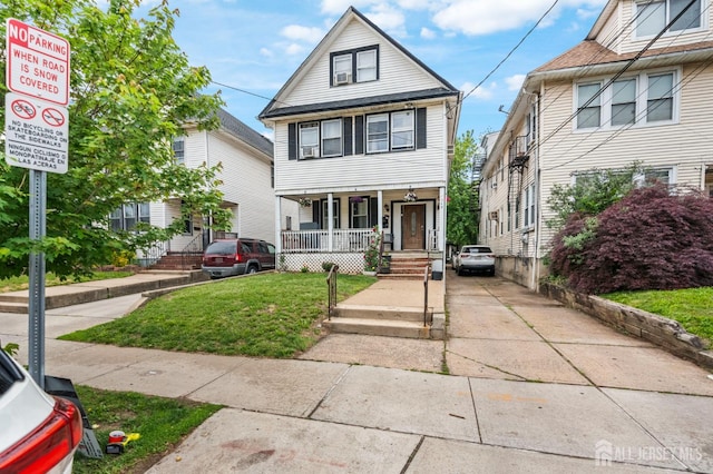 349 Livingston Ave, New Brunswick, NJ 08901 - traditional style home with a porch, concrete driveway, and a front yard
