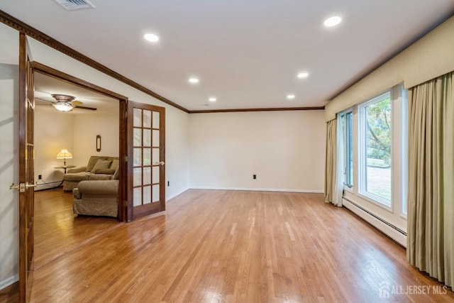 empty room with crown molding, a baseboard radiator, french doors, and light wood-type flooring