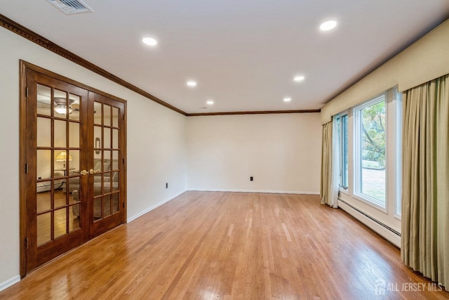 unfurnished room featuring french doors, a baseboard radiator, ornamental molding, and light wood-type flooring