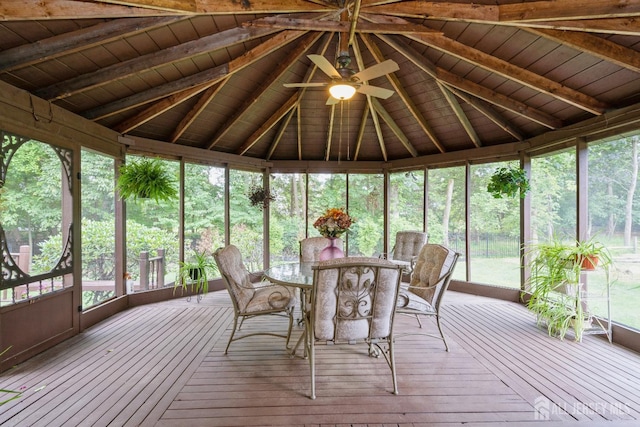 unfurnished sunroom with lofted ceiling with beams, wooden ceiling, and ceiling fan