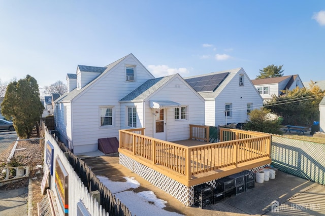 back of house featuring a deck