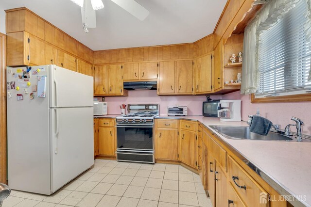 kitchen with white appliances, ceiling fan, light tile patterned floors, and sink