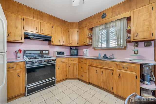 kitchen featuring sink and range with gas stovetop