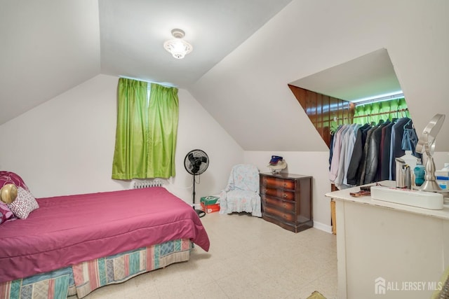 bedroom with lofted ceiling