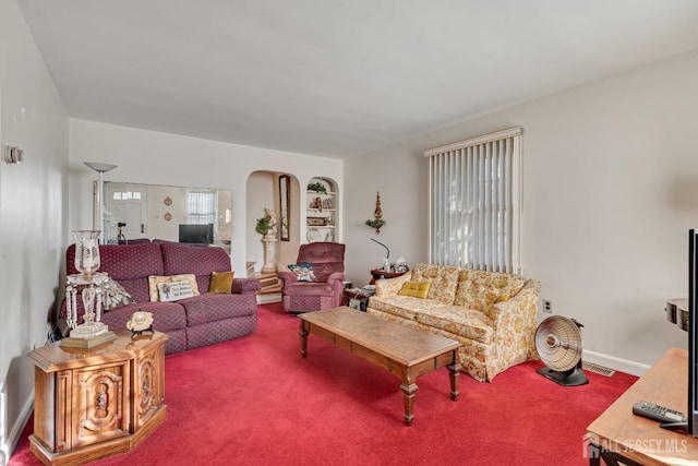 carpeted living room with built in features