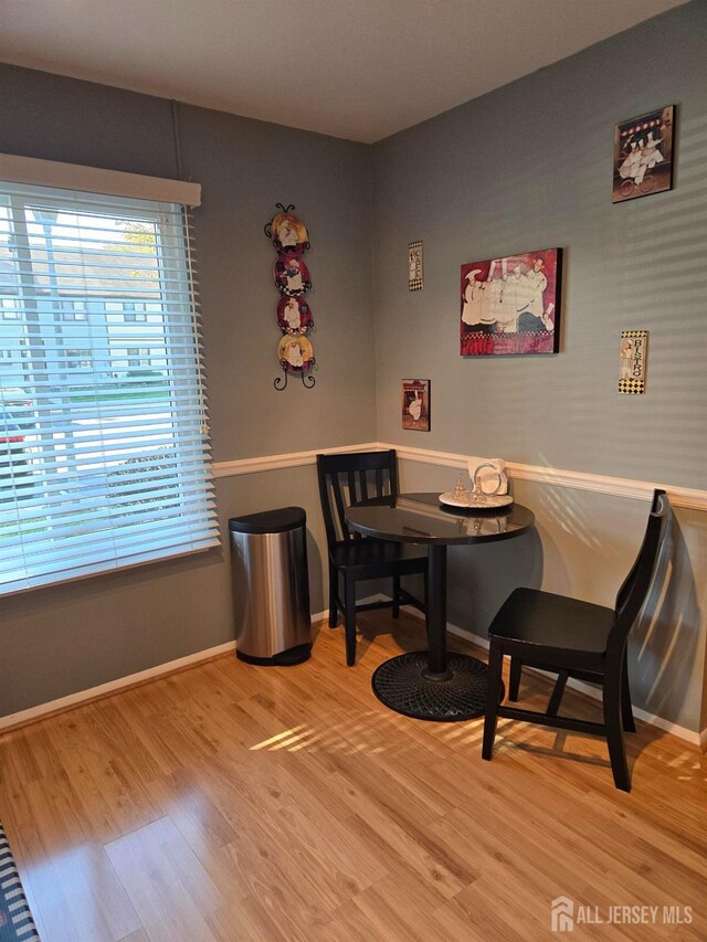 dining space featuring wood-type flooring