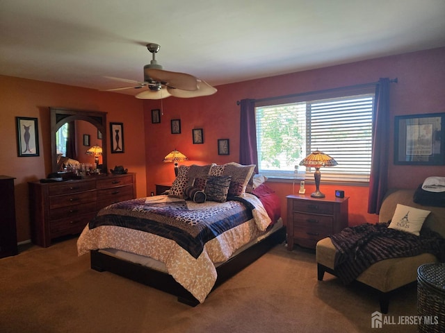 bedroom with ceiling fan and carpet floors