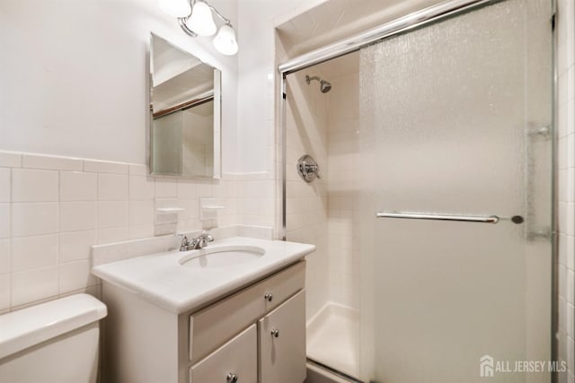 19 Redcoat Dr, East Brunswick, NJ 08816 - full bath featuring a stall shower, vanity, tile walls, and wainscoting