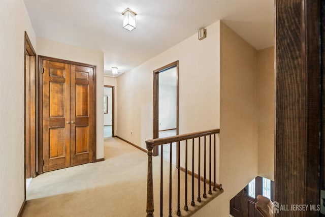 19 Redcoat Dr, East Brunswick, NJ 08816 - corridor featuring light colored carpet and an upstairs landing