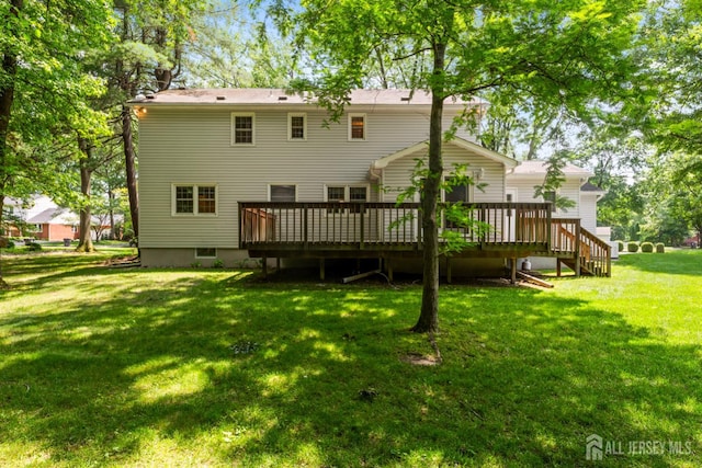 19 Redcoat Dr, East Brunswick, NJ 08816 - rear view of house featuring a wooden deck and a lawn